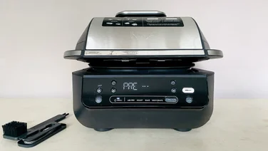 The Ninja 5-in-1 Grill & Air Fryer on a countertop