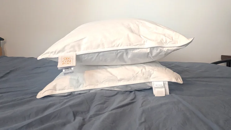 Two Odd Company Luxury Pillows, stacked on a mattress