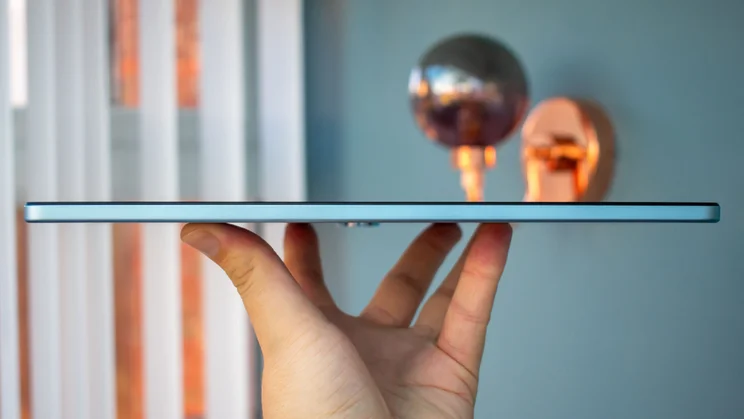OnePlus Pad Lite in hand, side view