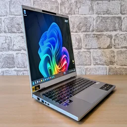 A photo of the Acer Aspire 14 AI laptop, open, from the front left corner