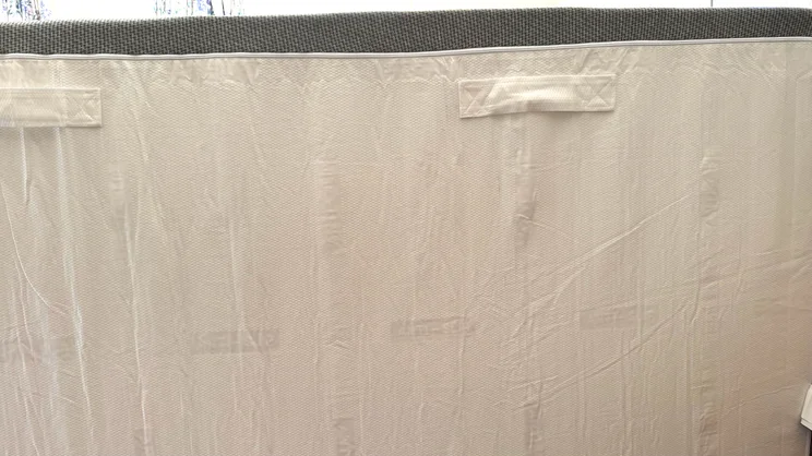 The underside of the REM-Fit 600 Lux Elite mattress, showing carry handles