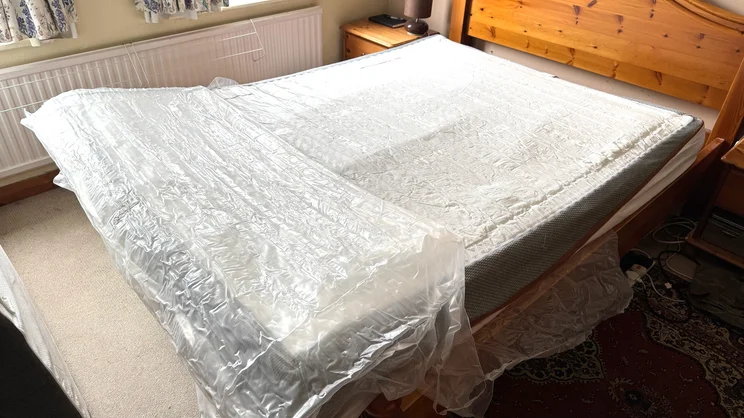 The REM-Fit 600 Lux Elite mattress being removed from its vacuum packaging