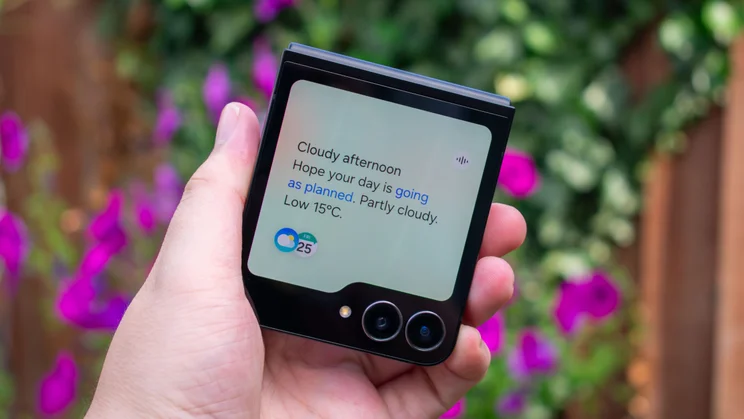 Galaxy Z Flip 7 FE folded in hand with the Now Brief feature on the cover display