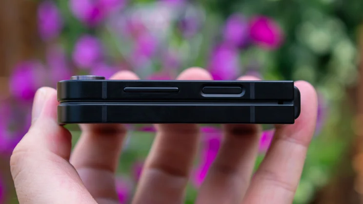 Galaxy Z Flip 7 FE folded in hand, side view