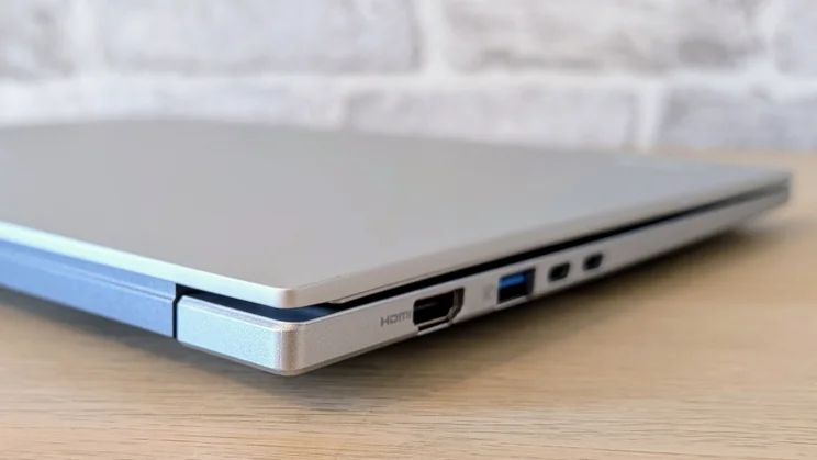 The Acer Aspire 14 AI laptop, closed, from the left rear corner