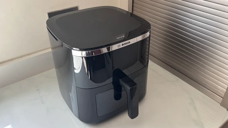 The Bosch Series 6 Air Fryer on a kitchen worktop, pictured from above and to the left