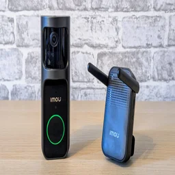 The Imou Doorbell 2S with its chime on a wood surface