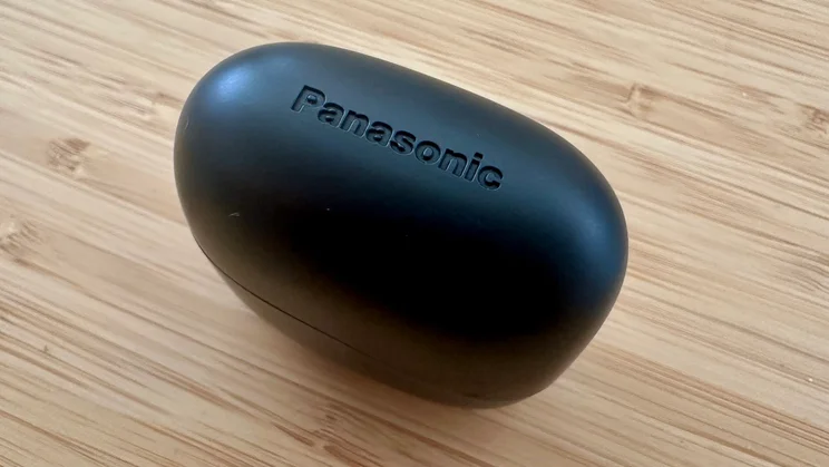 The Panasonic RB-F10's charging case on a wood table