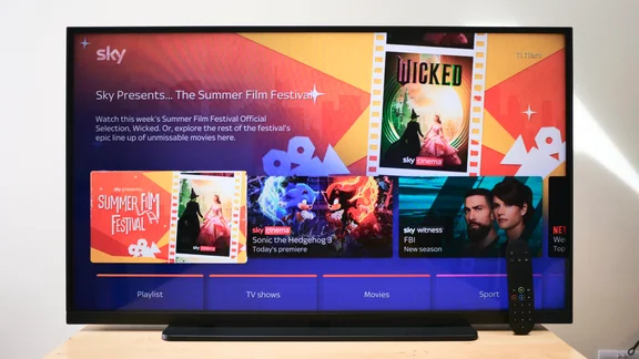 The Sky Glass Air on a table showing the home screen