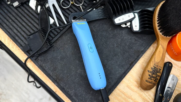 The Wahl Peanut Li trimmer charging on a barber's worktop
