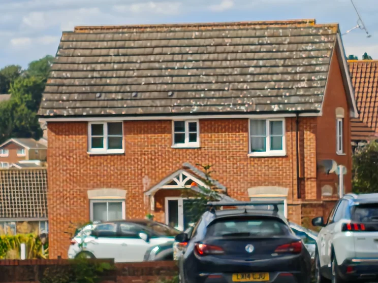 10x zoom of a red house