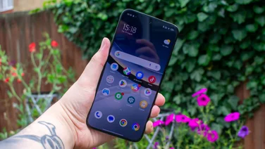 Xiaomi Poco F7 in hand, front view with the display on