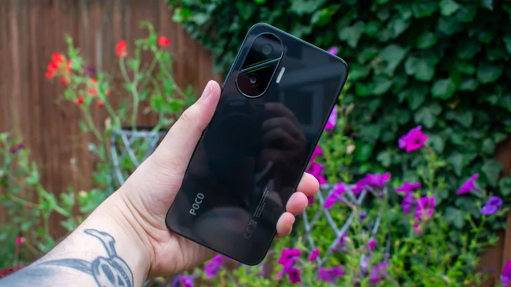 Xiaomi Poco F7 in hand, rear view