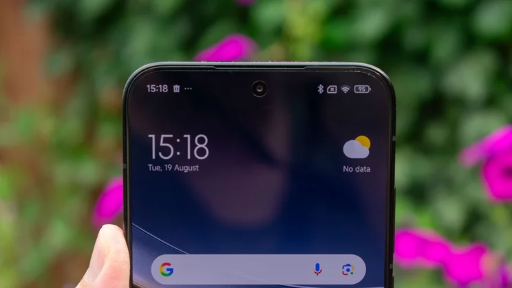 Xiaomi Poco F7 in hand, close up of the selfie camera