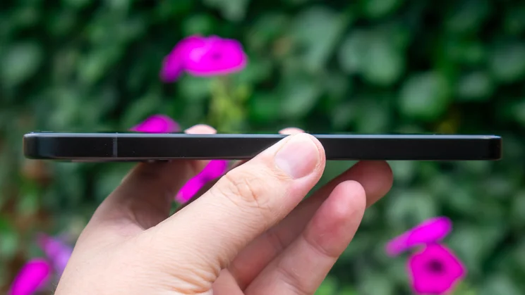 Xiaomi Poco F7 in hand, side view
