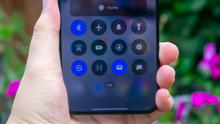 Xiaomi Poco F7 in hand, showing the control centre on the display