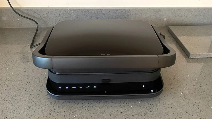The Zwilling Enfinigy Contact Grill, closed, on a kitchen countertop