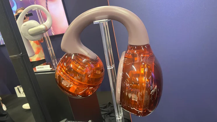 An enormous replica showing off the design of the JBL Soundgear Clips open-ear headphones