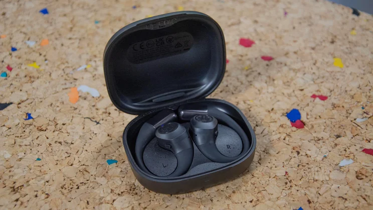 The JLab Epic Open Sport's charging case open with the headphones inside
