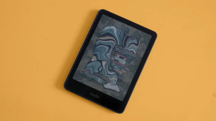 The Amazon Kindle Colorsoft pictured from the front against an orange background