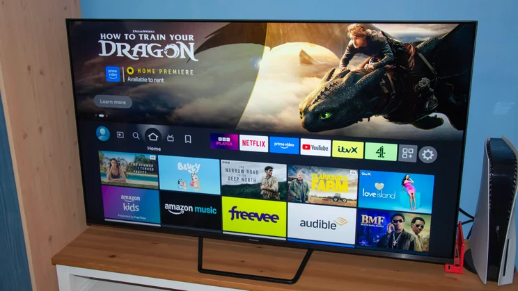 The Fire TV OS homepage being displayed on the Panasonic W95B Mini LED TV