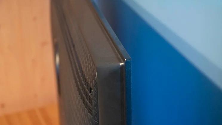 An image shot from the side of the Panasonic W95B Mini LED TV demonstrating the thickness of its panel