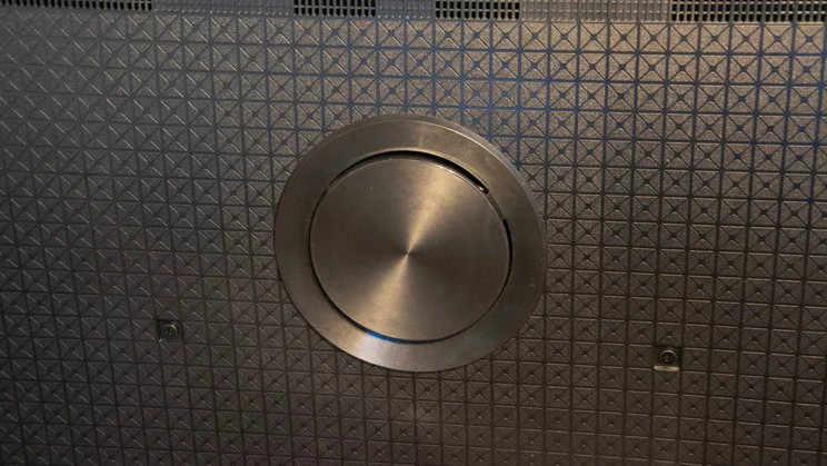 Close-up of the subwoofer built into the rear of the Panasonic W95B Mini LED TV