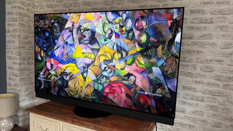Right-hand side view of the Panasonic Z95B OLED displaying the Fire TV Ambient Experience screensaver "Ballet" by Aristarkh Lentulov