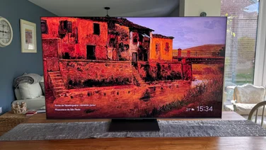 Front view of the TCL C8K QD-Mini LED TV on a kitchen table