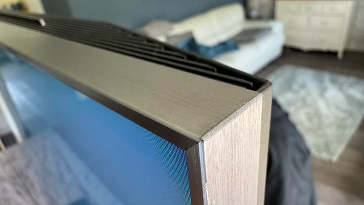Close-up of the top-right corner of the TCL C8K QD-Mini LED TV's panel