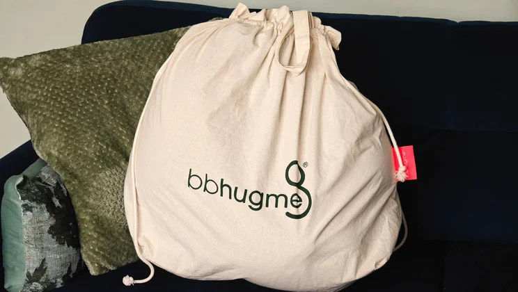 The Bbhugme pregnancy pillow in its bag