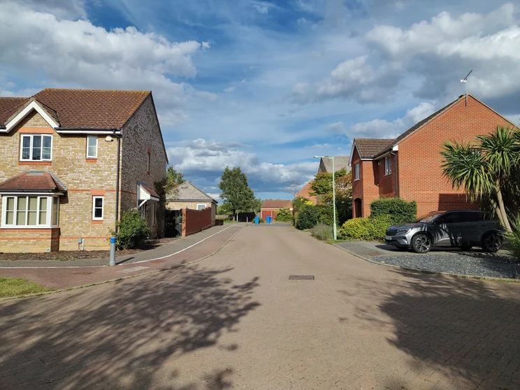 A quiet road with houses on both sides