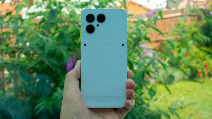 Fairphone 6 in hand, rear view