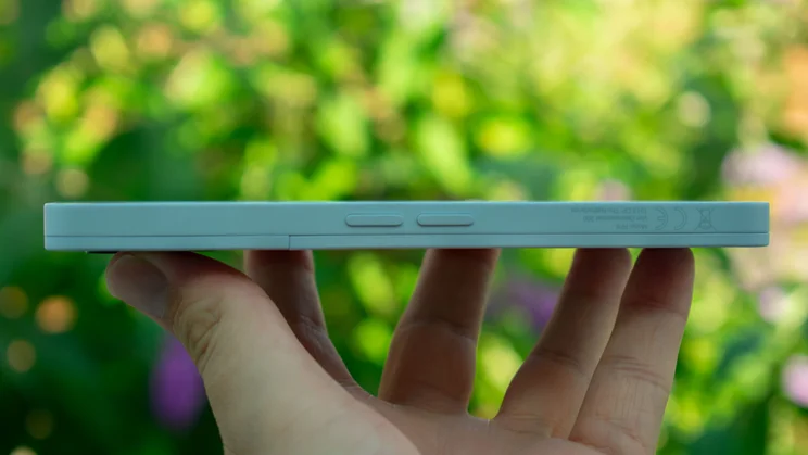 Fairphone 6 in hand, side view