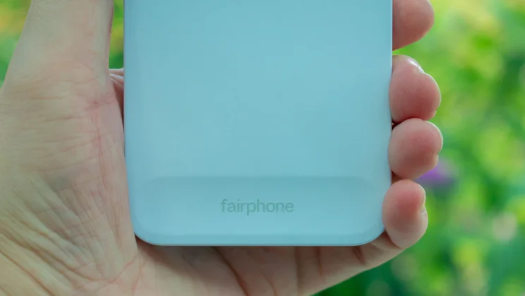 Fairphone 6 in hand, showing the Fairphone logo