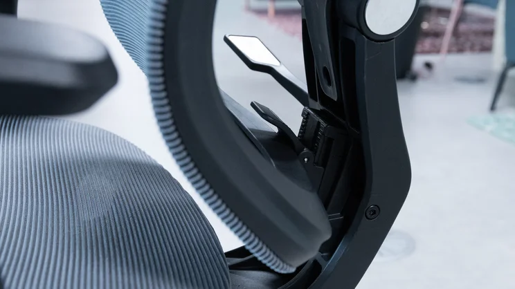 A closeup of the The Flexispot C7 office chair's lumbar support height lever