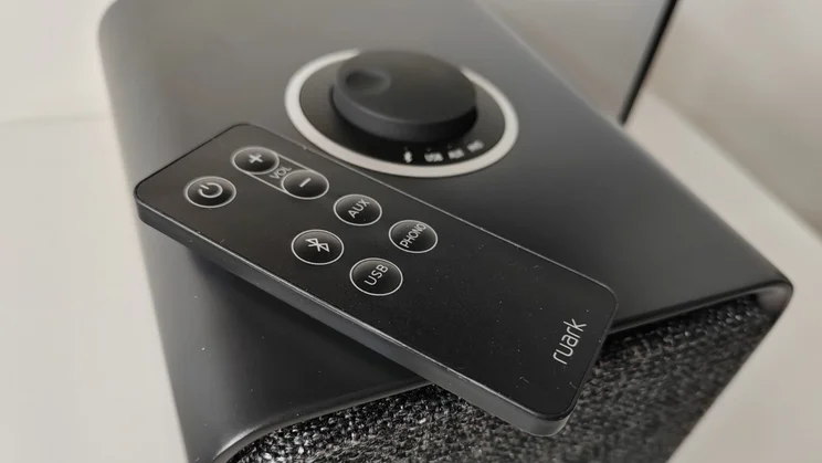 A close up of the Ruark MR1 Mk3 speakers' control dial and remote control