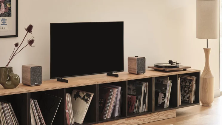 The Ruark MR1 Mk3 speakers on a media shelf flanking a TV
