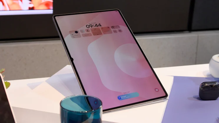 The Samsung Galaxy Tab S11 Ultra propped up in portrait orientation on a white table