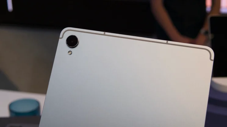 The. Samsung Galaxy Tab S11's single camera lens pictured close up with a dark blurred background