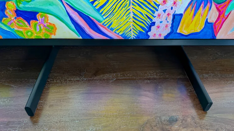The Samsung 75QN900F's legs, shown positioned in the centre