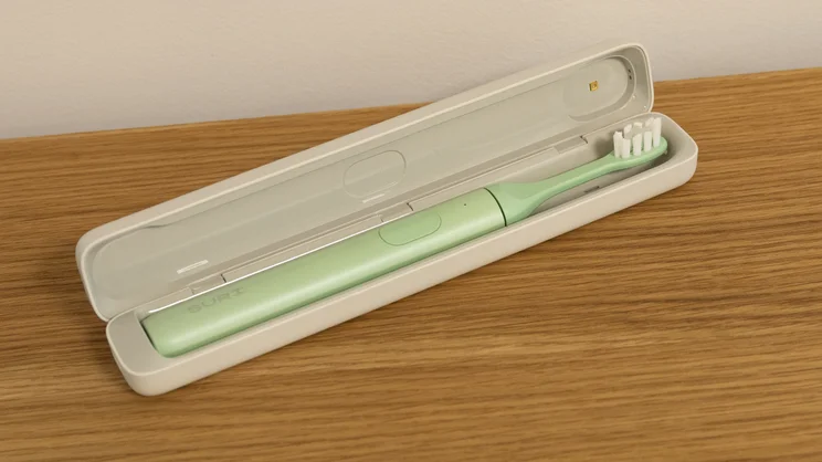 The Suri 2.0 electric toothbrush in its travel case