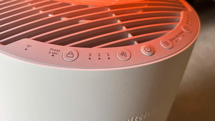 A closeup of the SwitchBot air purifier's control buttons, with red light on