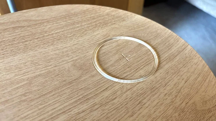 A closeup of the The SwitchBot air purifier's wireless charger on the tabletop attachment