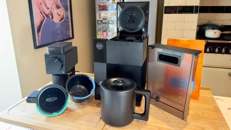 The Fellow Aiden coffee machine pictured with its twin baskets, thermal jug and water tank