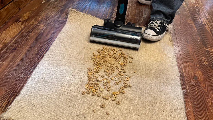 Using the VAX HomePro Detect Pet-Design vacuum cleaner to clean cheerios off carpet