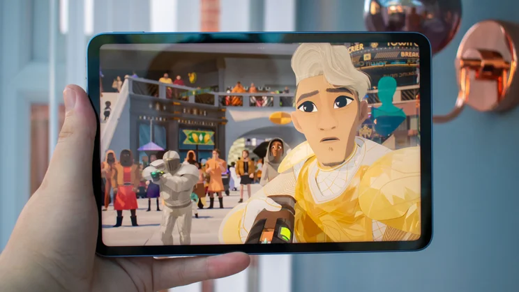 Xiaomi Pad Mini in hand, movie on the display