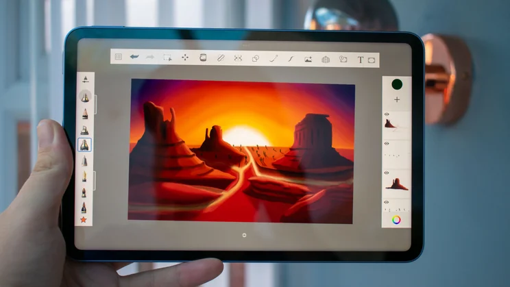 Xiaomi Pad Mini in hand, sketching app on the display