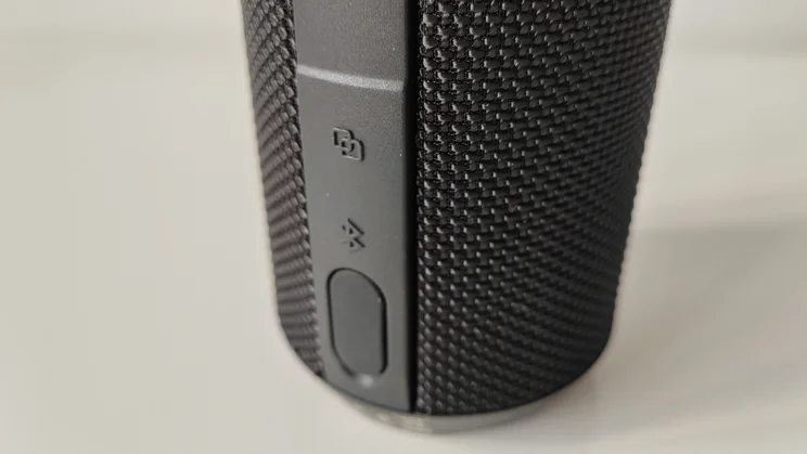 Close-up of the rubber bung protecting the connection ports on the AO Portable Wireless Speaker