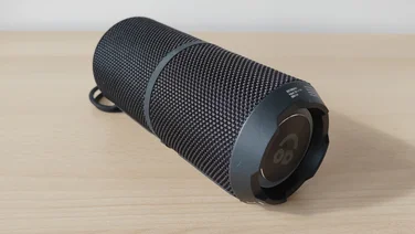 The AO Portable Wireless Speaker lying flat on a table